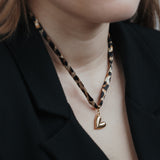 Ketting met leopardprint en hartjes bedel